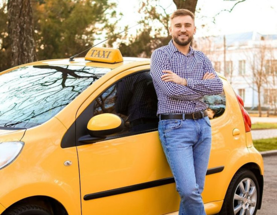 Person getting into a yellow cab with a smile